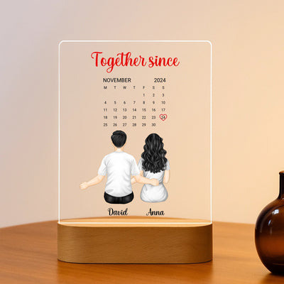 LED-Acrylleuchte auf Holzoberfläche